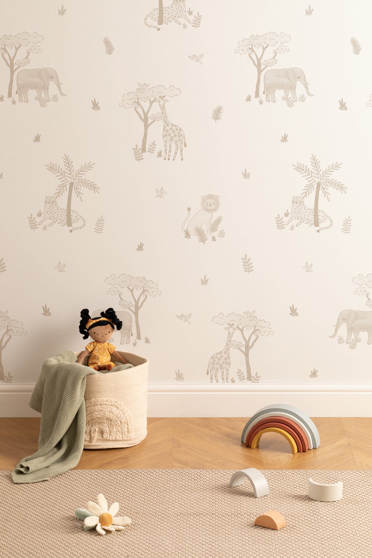 The Savanna Parade wallpaper in warm sand on a nursery wall