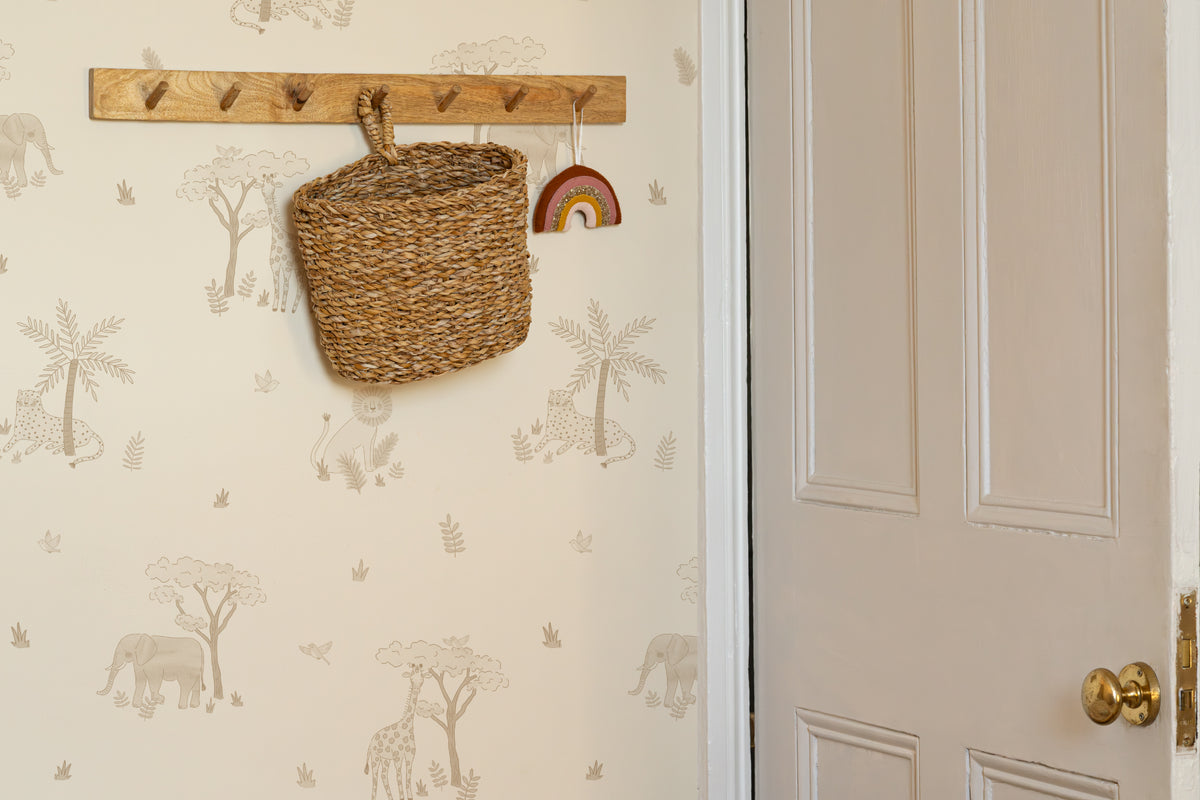 The Savanna Parade wallpaper in warm sand in a hallway
