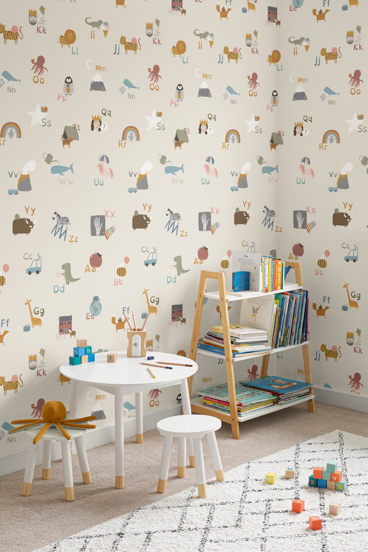 The Schoolroom Primer wallpaper in oatmeal and pastel in a children's room setting, another angle