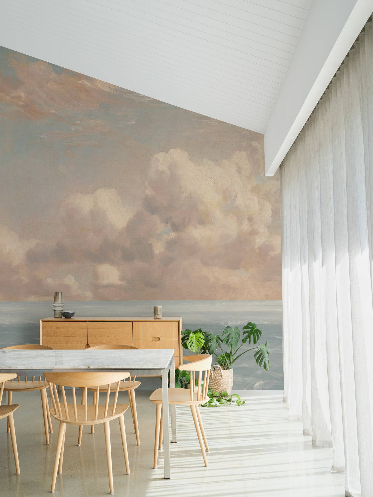 The Seaward Sky mural in peach and sea blue on a nursery wall