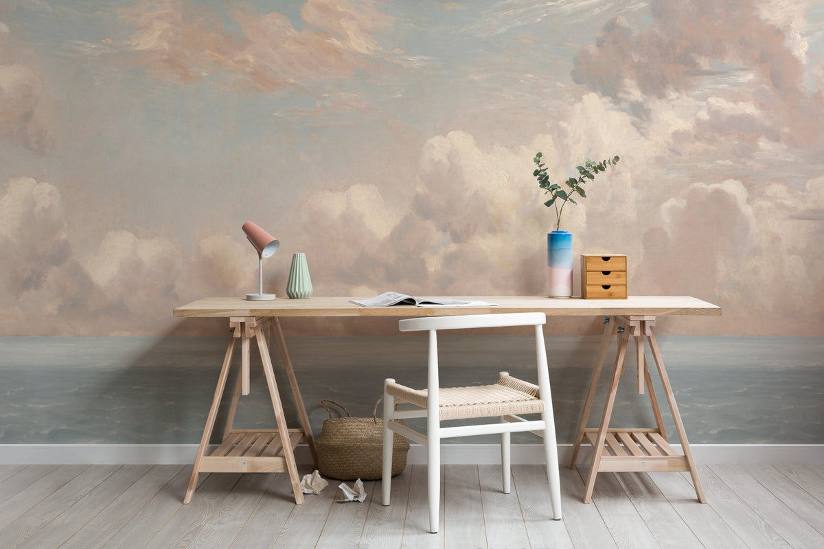 The Seaward Sky mural in peach and sea blue behind a desk in a home office