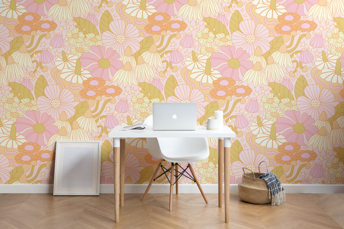 The Seventies Bloom mural in pastel pink in a study corner with a desk