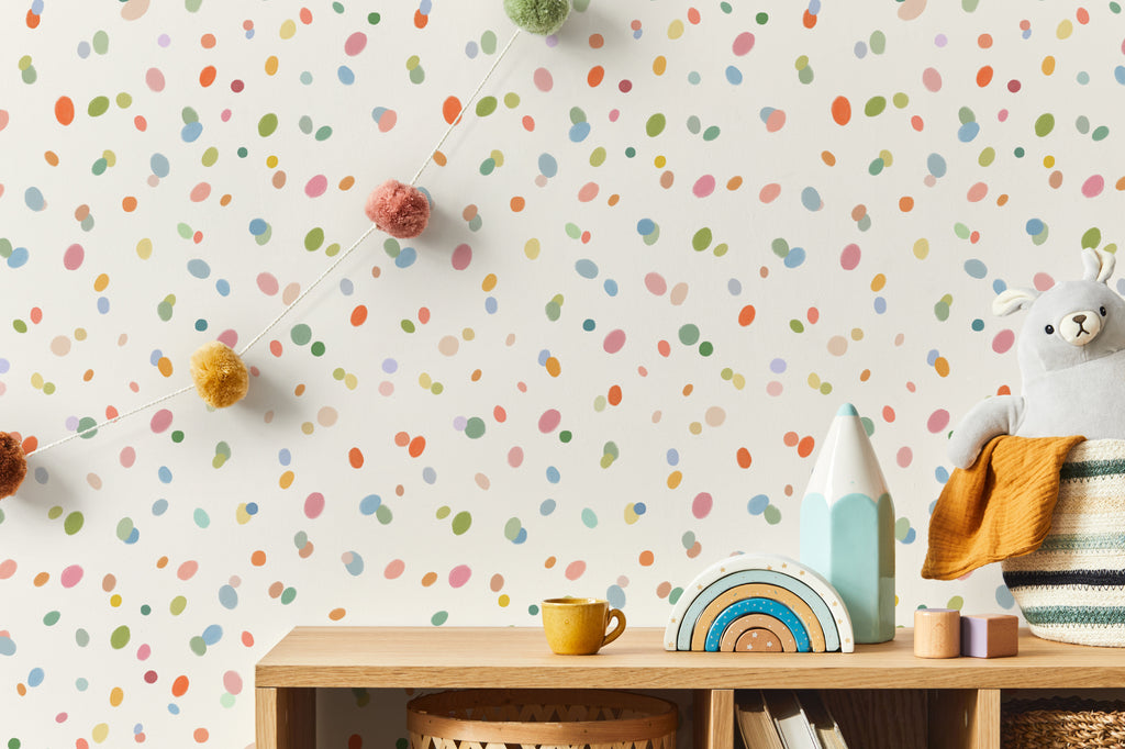 The Sherbet Confetti wallpaper in pastel multi in a child's bedroom
