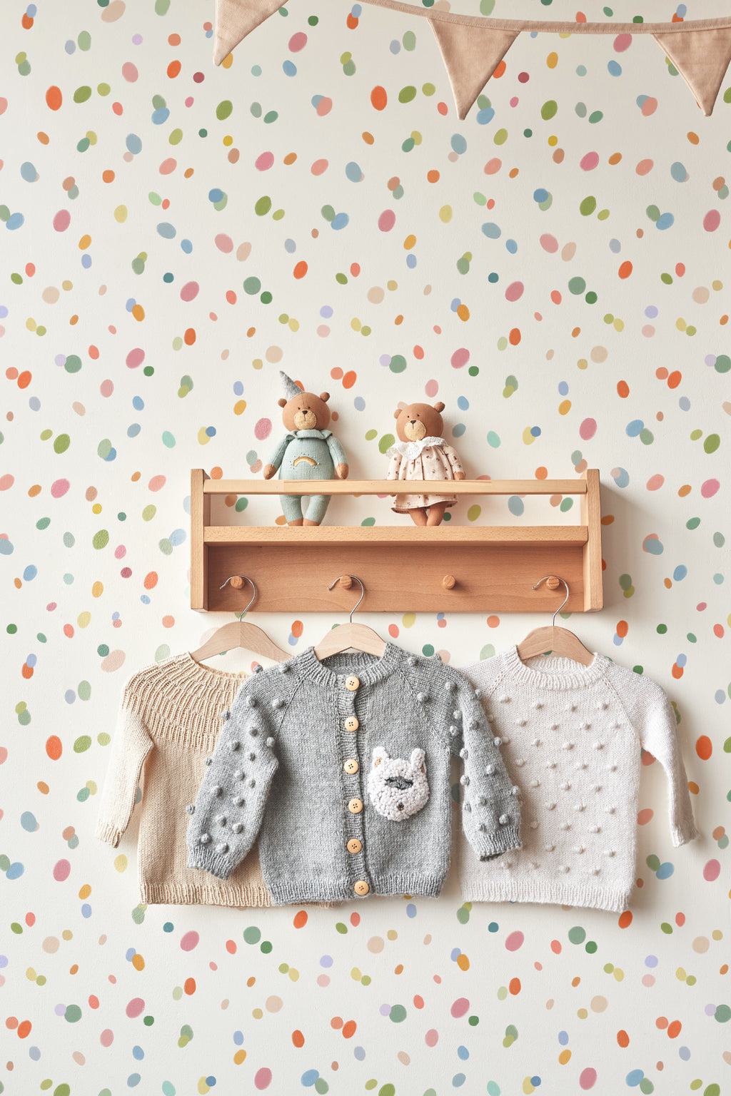 The Sherbet Confetti wallpaper in pastel multi in a children's room setting
