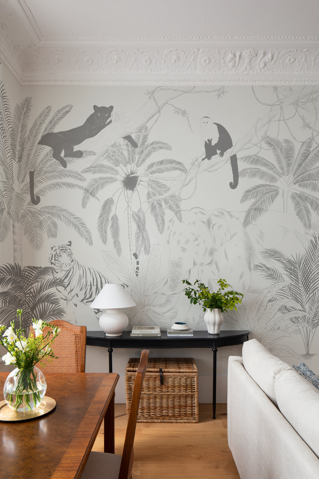 The Sketched Sanctuary mural in soft graphite behind a styled console