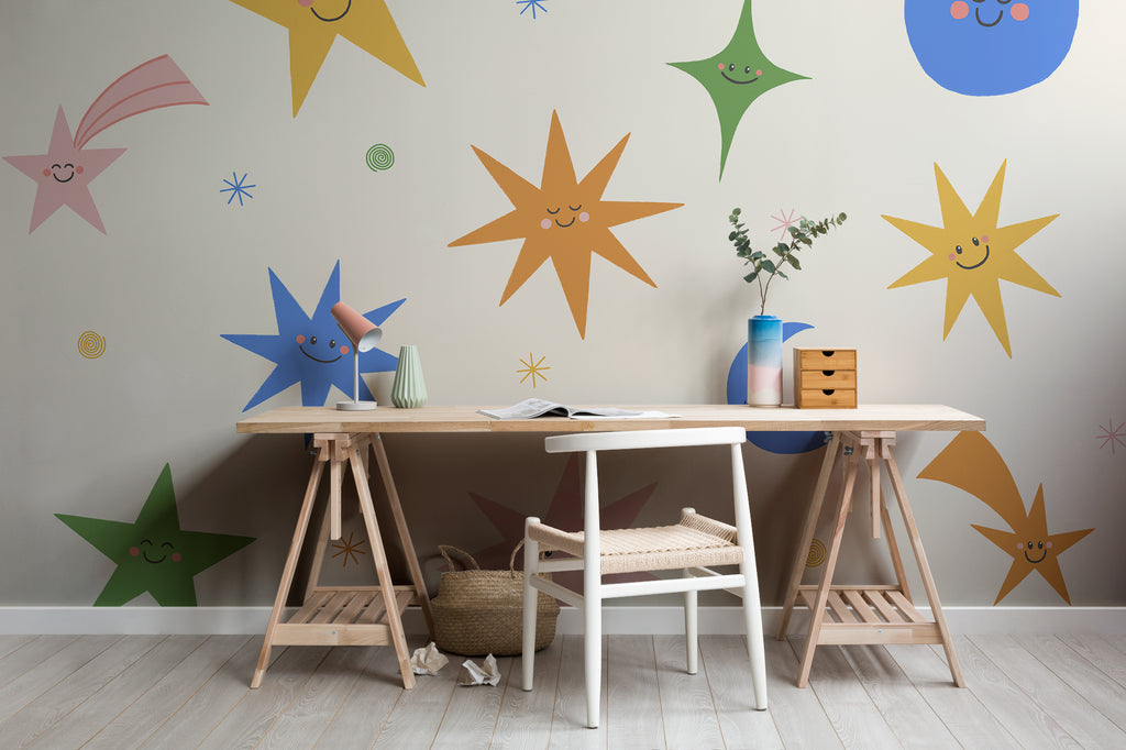 The Smiling Cosmos mural in sunshine and cobalt in a child's bedroom