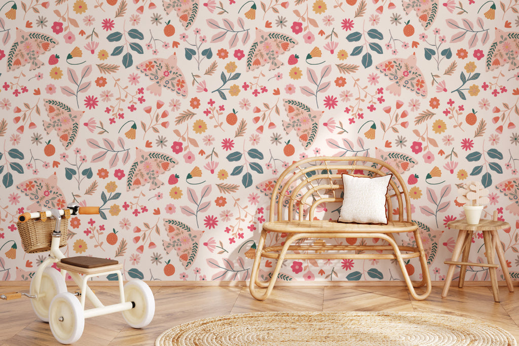 The Songbird Parterre wallpaper in blush and coral behind a kids' play corner