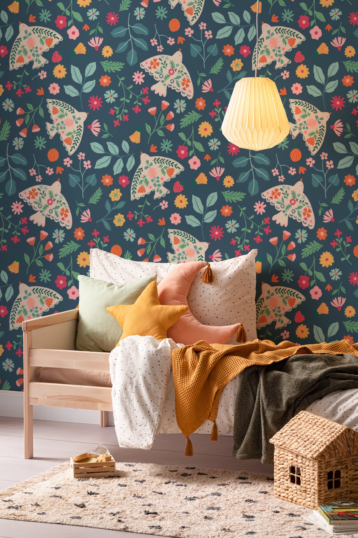 The Songbird Parterre wallpaper in midnight navy behind a kids' play corner