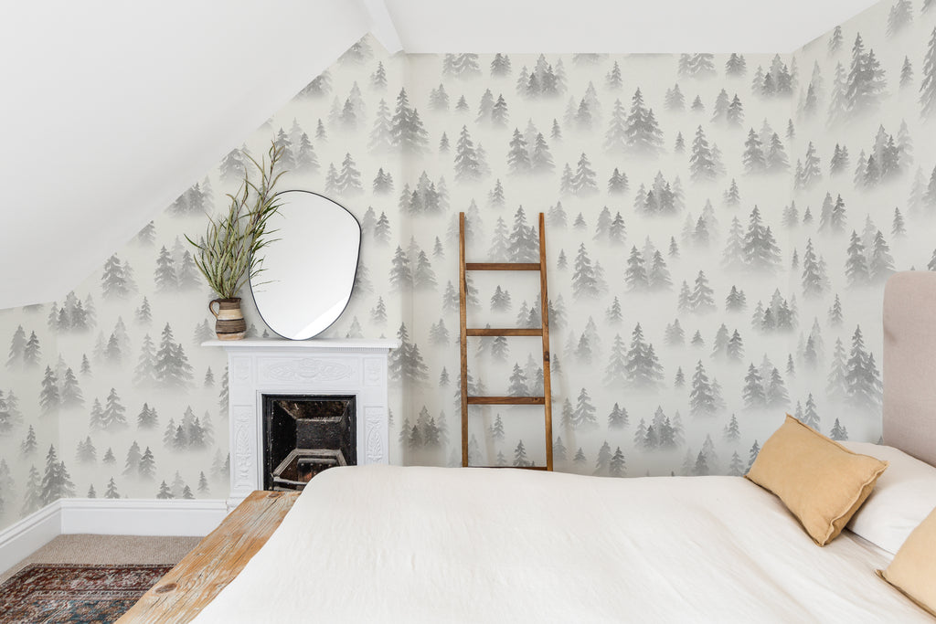The Spruce Mist mural in fog grey as a backdrop to styled furniture