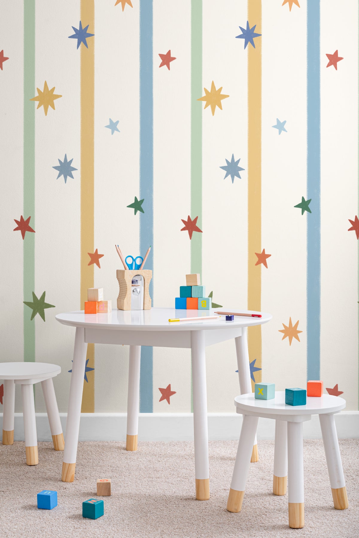 The Star Ribbon mural in sunflower and sky on a nursery wall