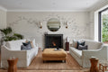 The Starling Murmuration mural in mist grey and oat in a living room