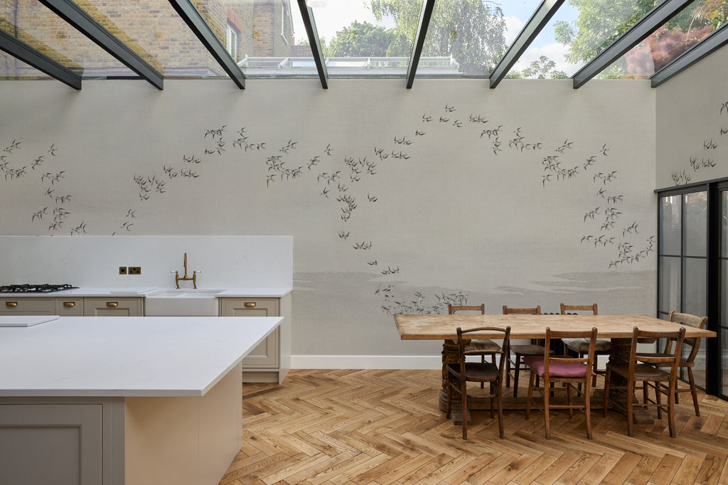 The Starling Murmuration mural in mist grey and oat in a kitchen