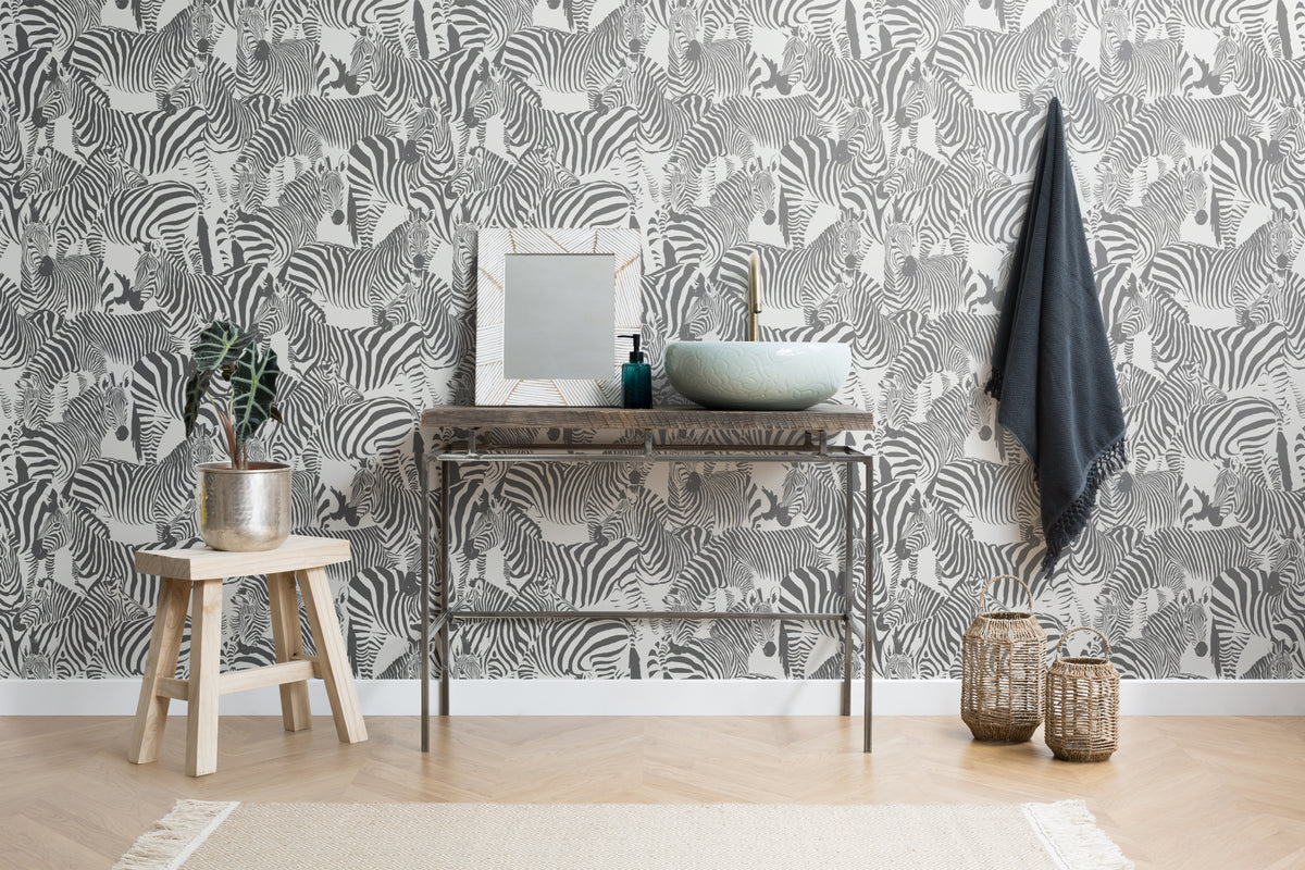 The Striped Herd wallpaper in black and white as a backdrop to styled furniture