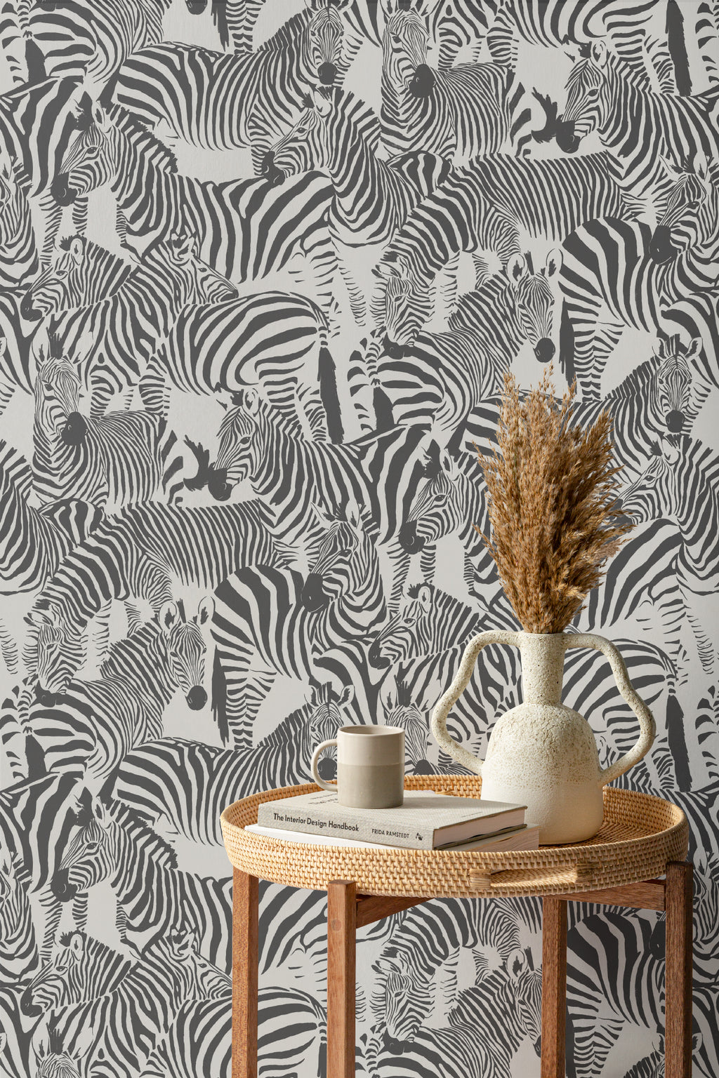 The Striped Herd wallpaper in black and white in a styled vignette