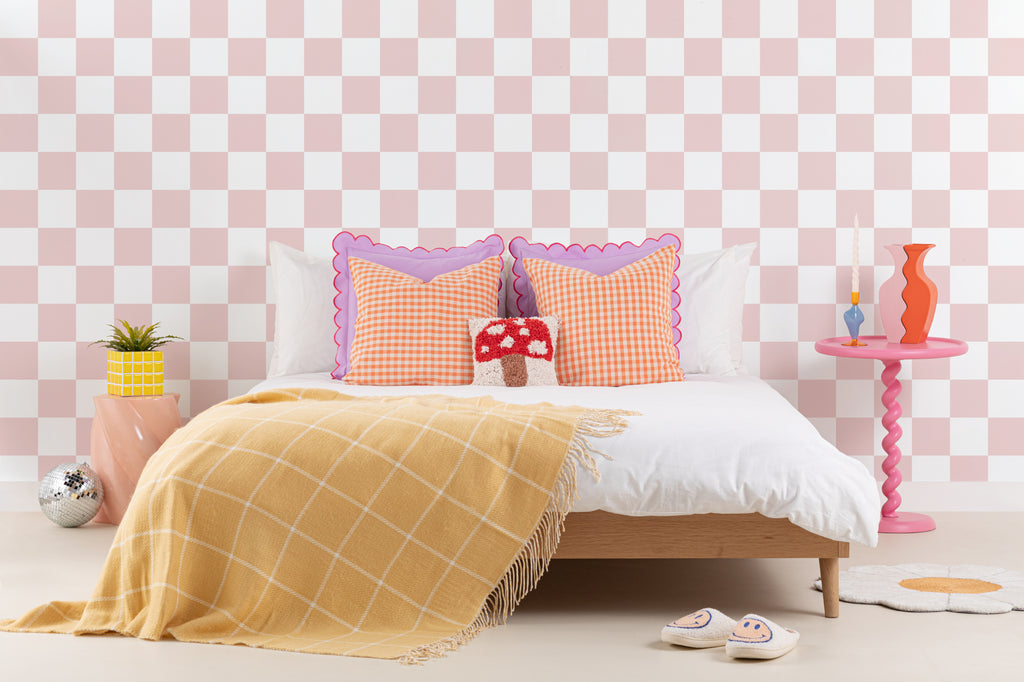 The Sugar Check wallpaper in candy pink and white in a child's bedroom