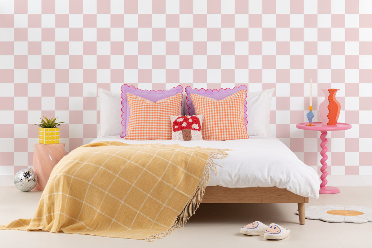 The Sugar Check wallpaper in candy pink and white in a child's bedroom