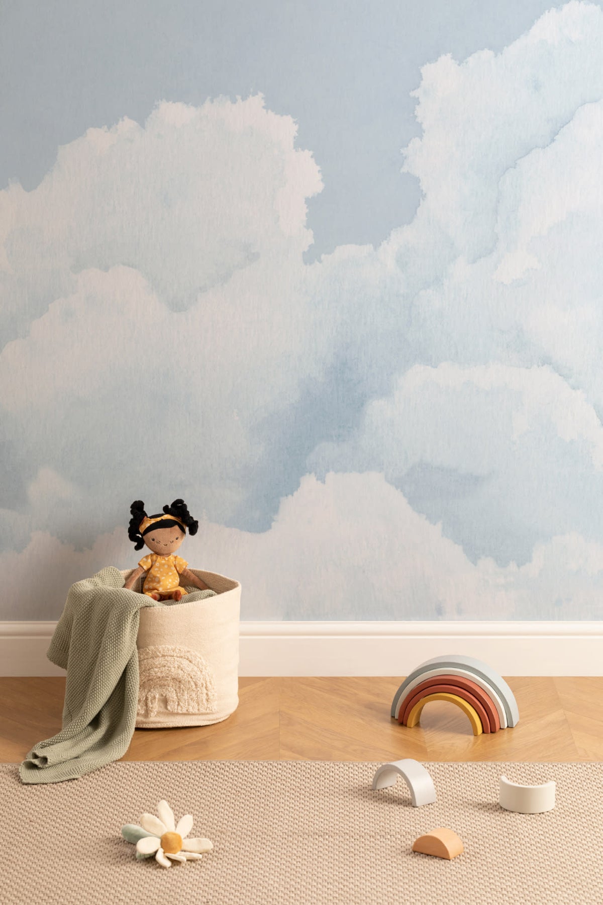 The Summer Cloudscape mural in pastel sky blue on a nursery wall