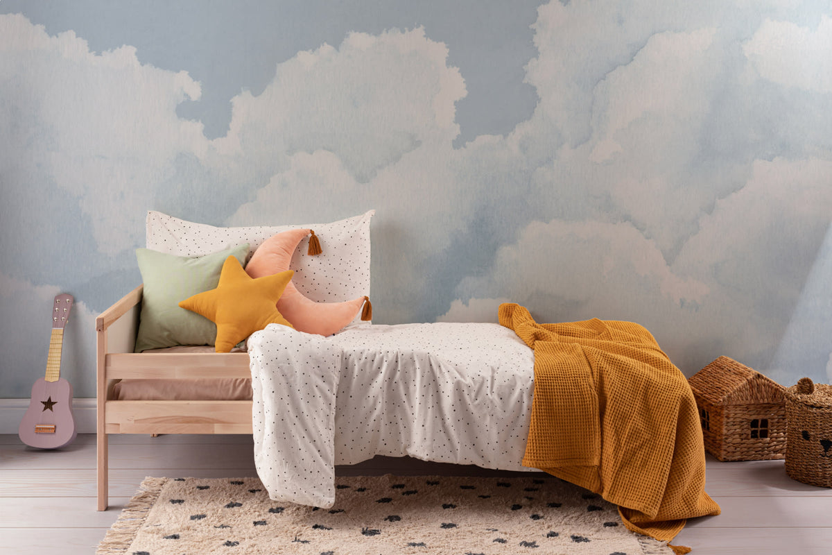 The Summer Cloudscape mural in pastel sky blue in a child's bedroom