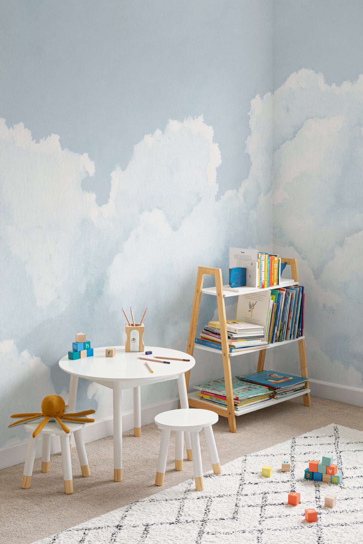 The Summer Cloudscape mural in pastel sky blue in a children's room setting, another angle