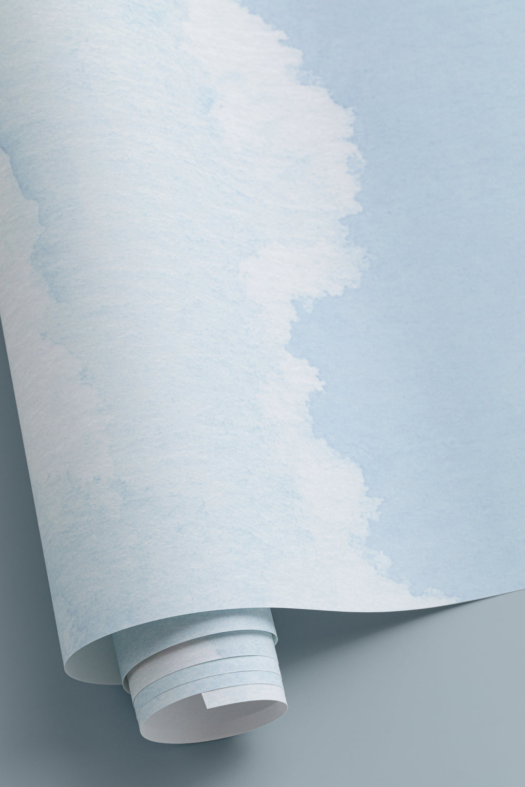 Angled detail of The Summer Cloudscape mural in pastel sky blue