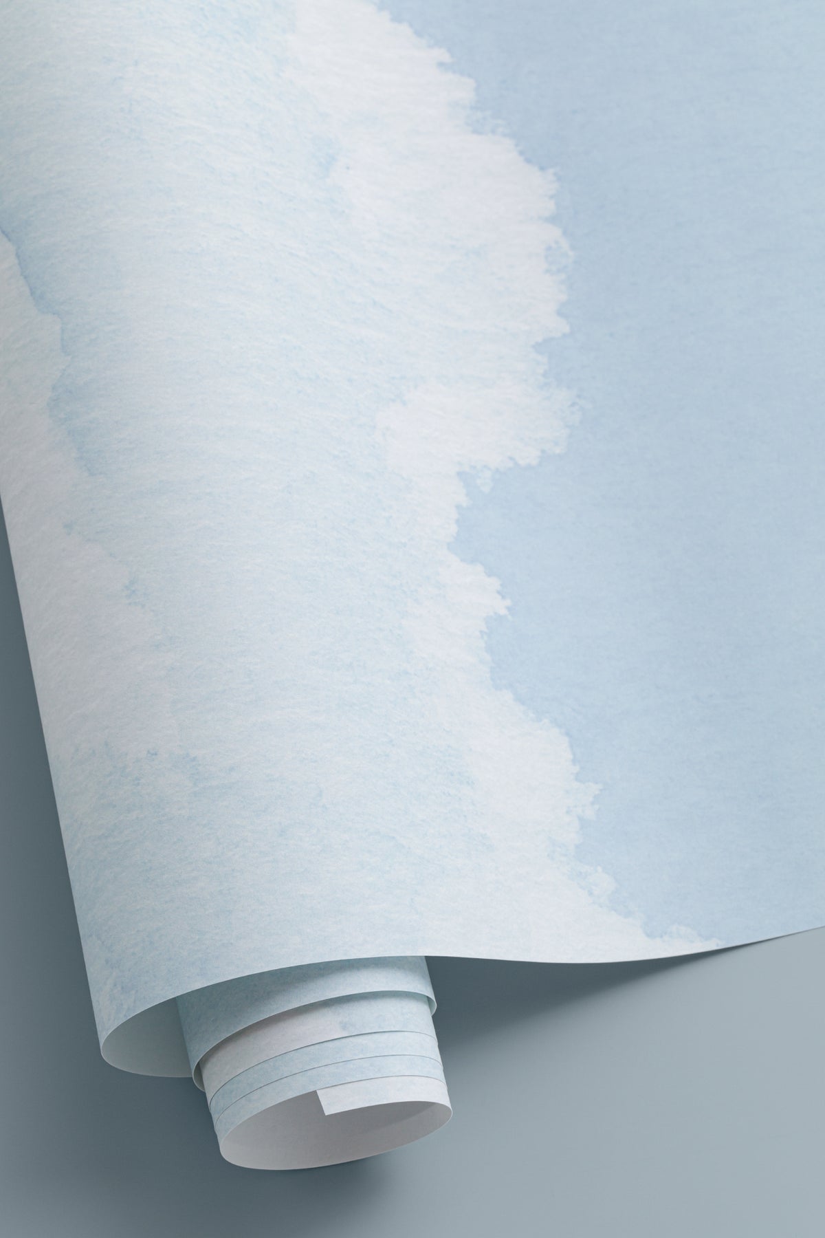 Angled detail of The Summer Cloudscape mural in pastel sky blue