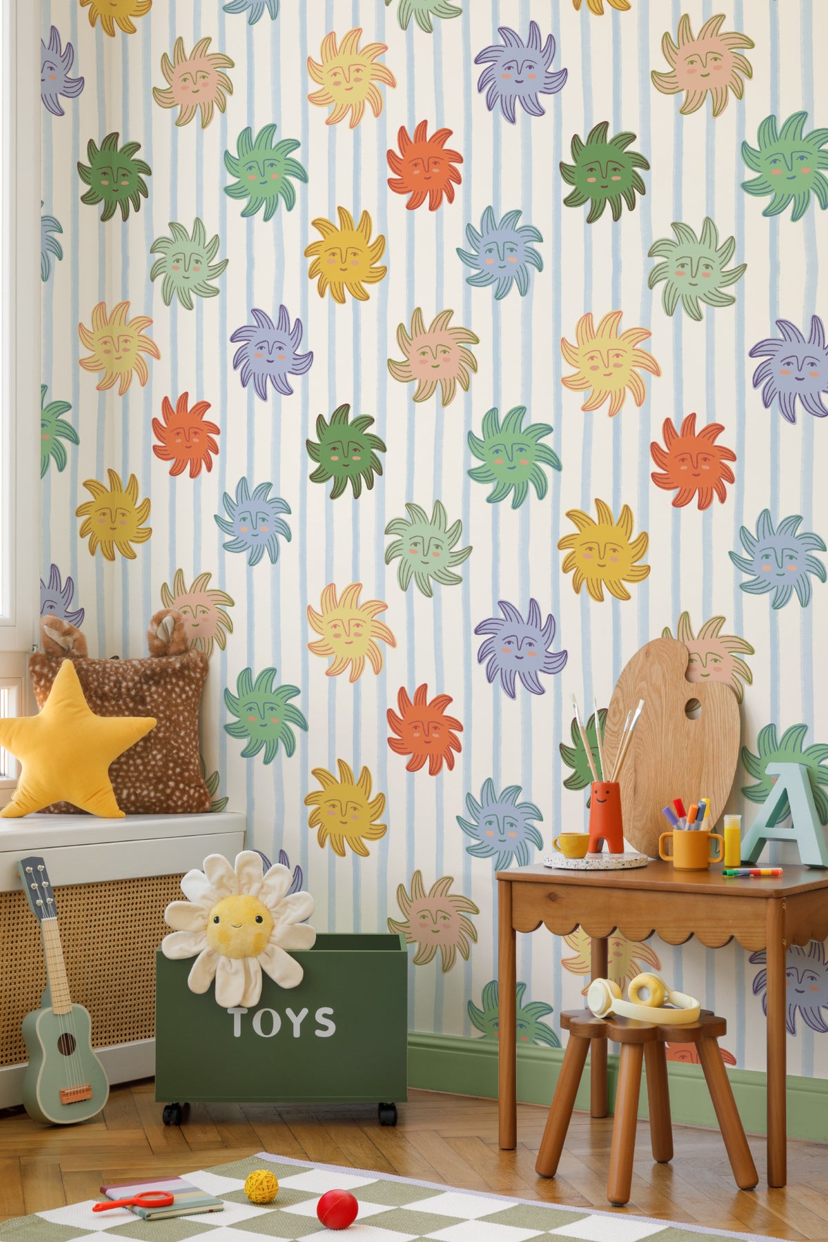 The Sunbeam Stripe wallpaper in duck egg and sunshine on a nursery wall