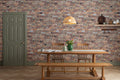 The Terrace Brickwork mural in umber brown behind a dining table