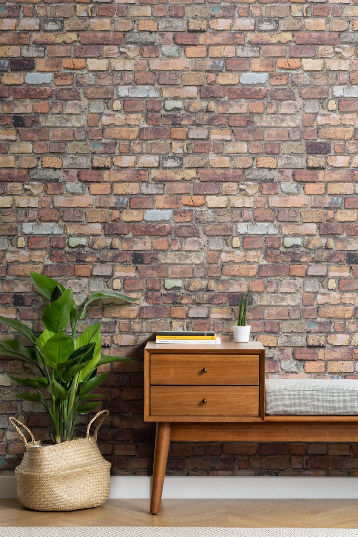 The Terrace Brickwork mural in umber brown behind a styled console