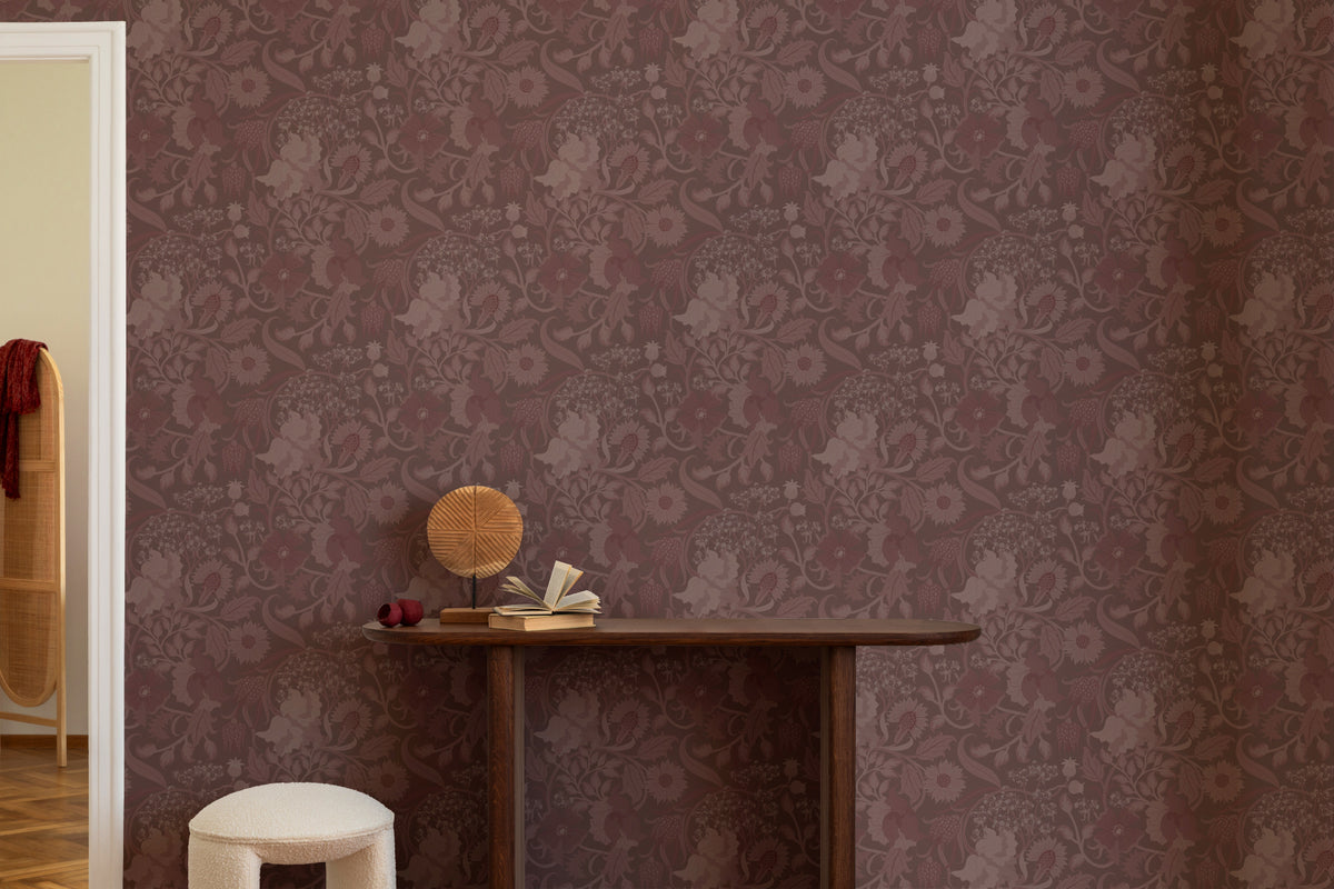 The Thistle Manor wallpaper in mulberry plum behind seating in a living room