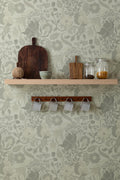 The Thistle Manor wallpaper in sage green behind a styled console