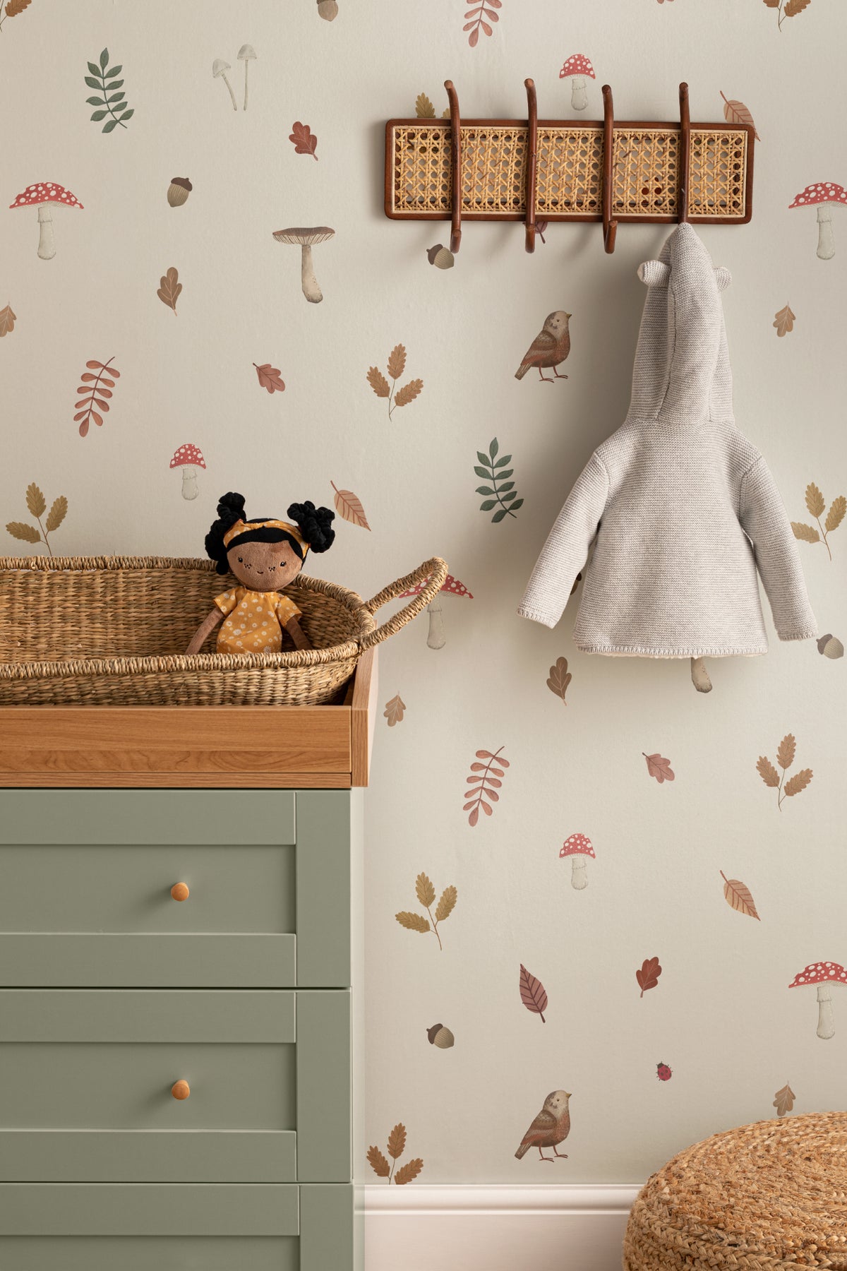 The Toadstool Wood mural in oat and russet on a nursery wall
