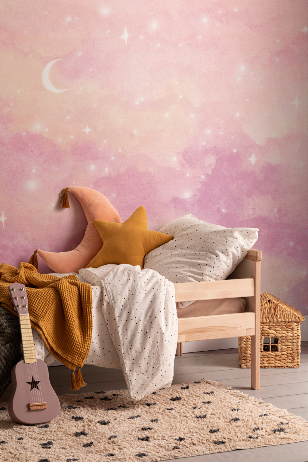 The Twilight Nebula mural in rose and lilac in a child's bedroom