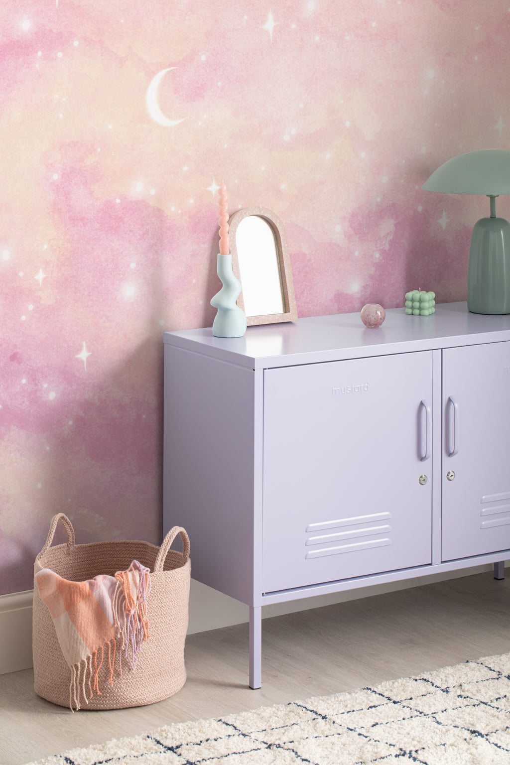 The Twilight Nebula mural in rose and lilac in a children's room setting, another angle