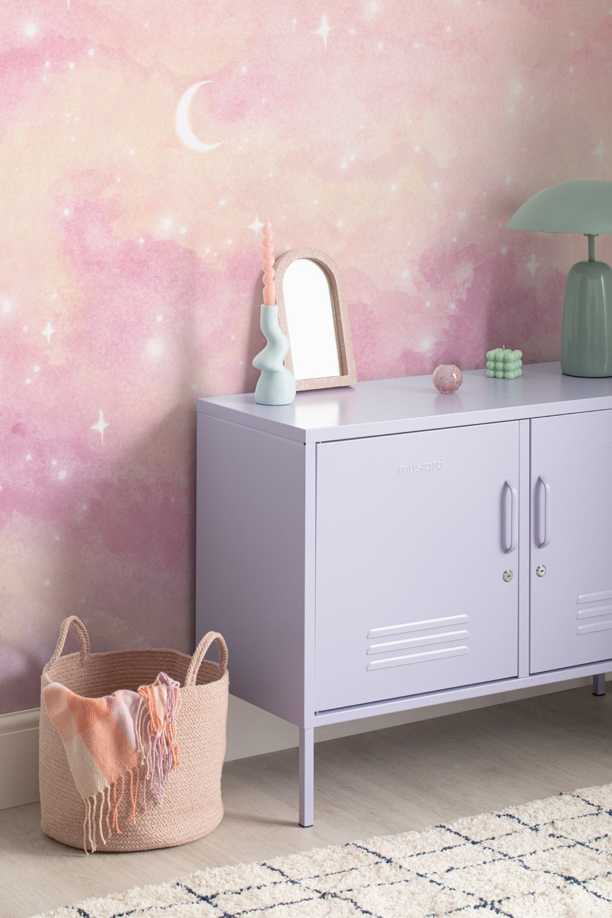 The Twilight Nebula mural in rose and lilac in a children's room setting, another angle