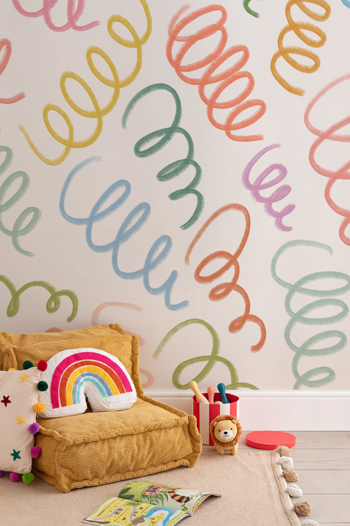 The Twirling Coil mural in candy red and blue on a nursery wall