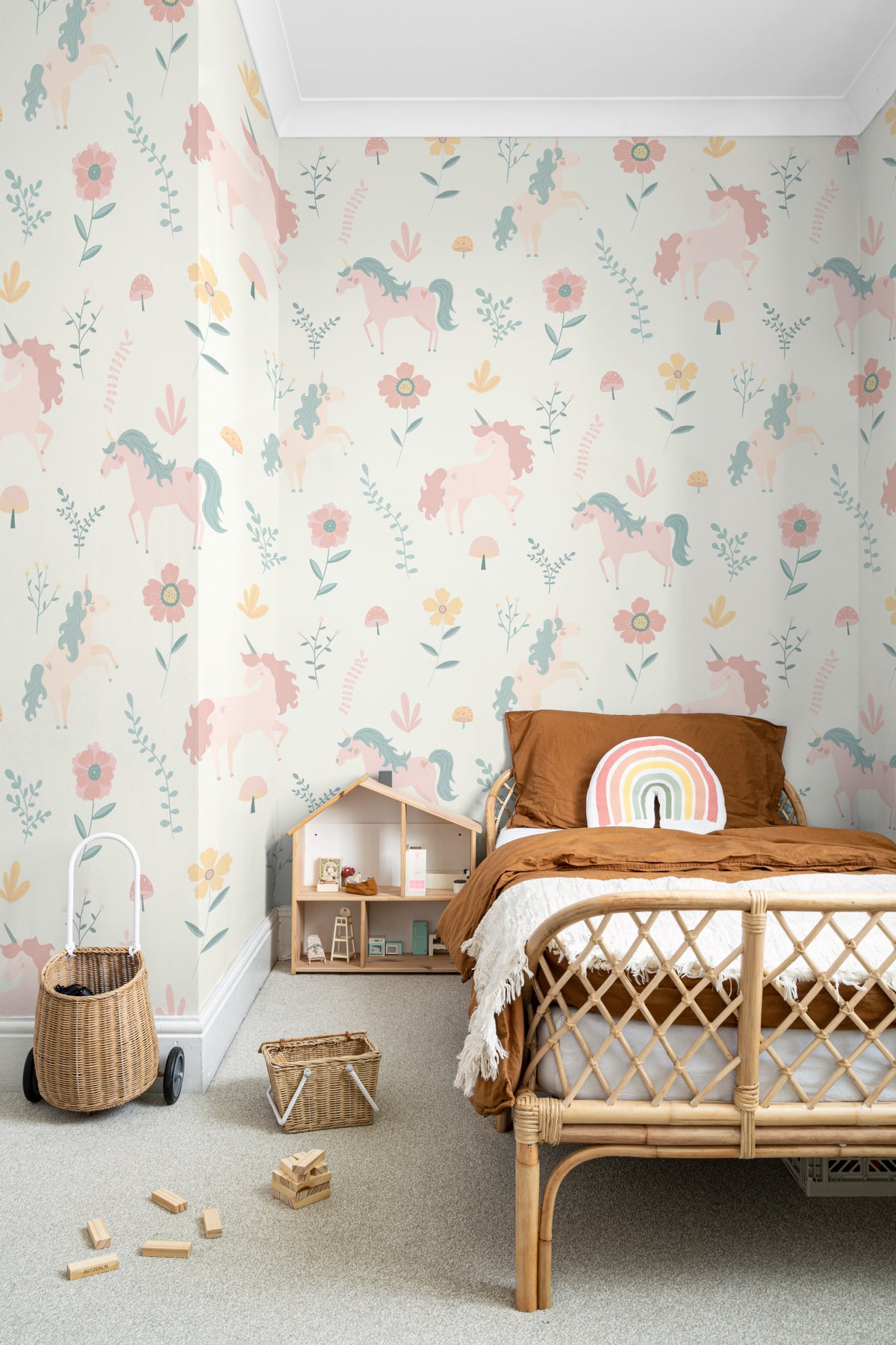 The Unicorn Garden wallpaper in soft pastel in a children's room setting, another angle
