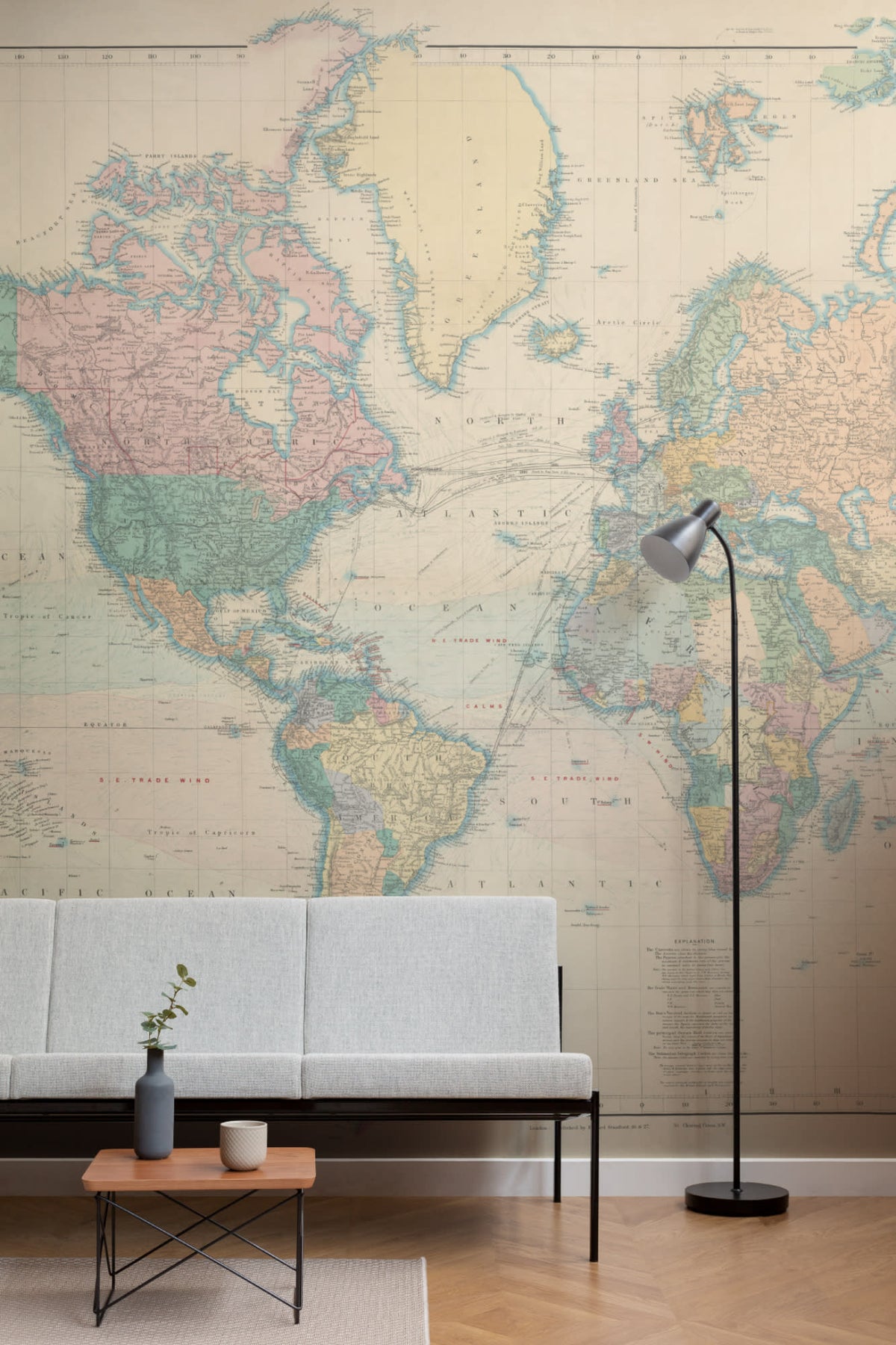 The Voyager Atlas mural in aged parchment in a living room