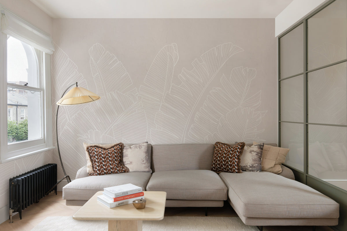 The Whisper Leaf mural in pale oat in a living room
