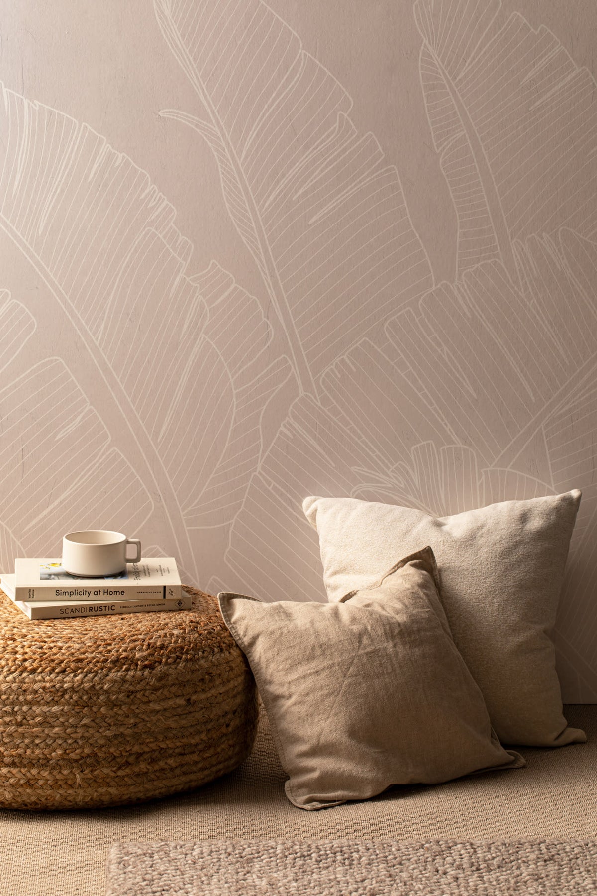 The Whisper Leaf mural in pale oat behind a styled console