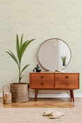 The Willow Breeze wallpaper in soft celery behind a styled console
