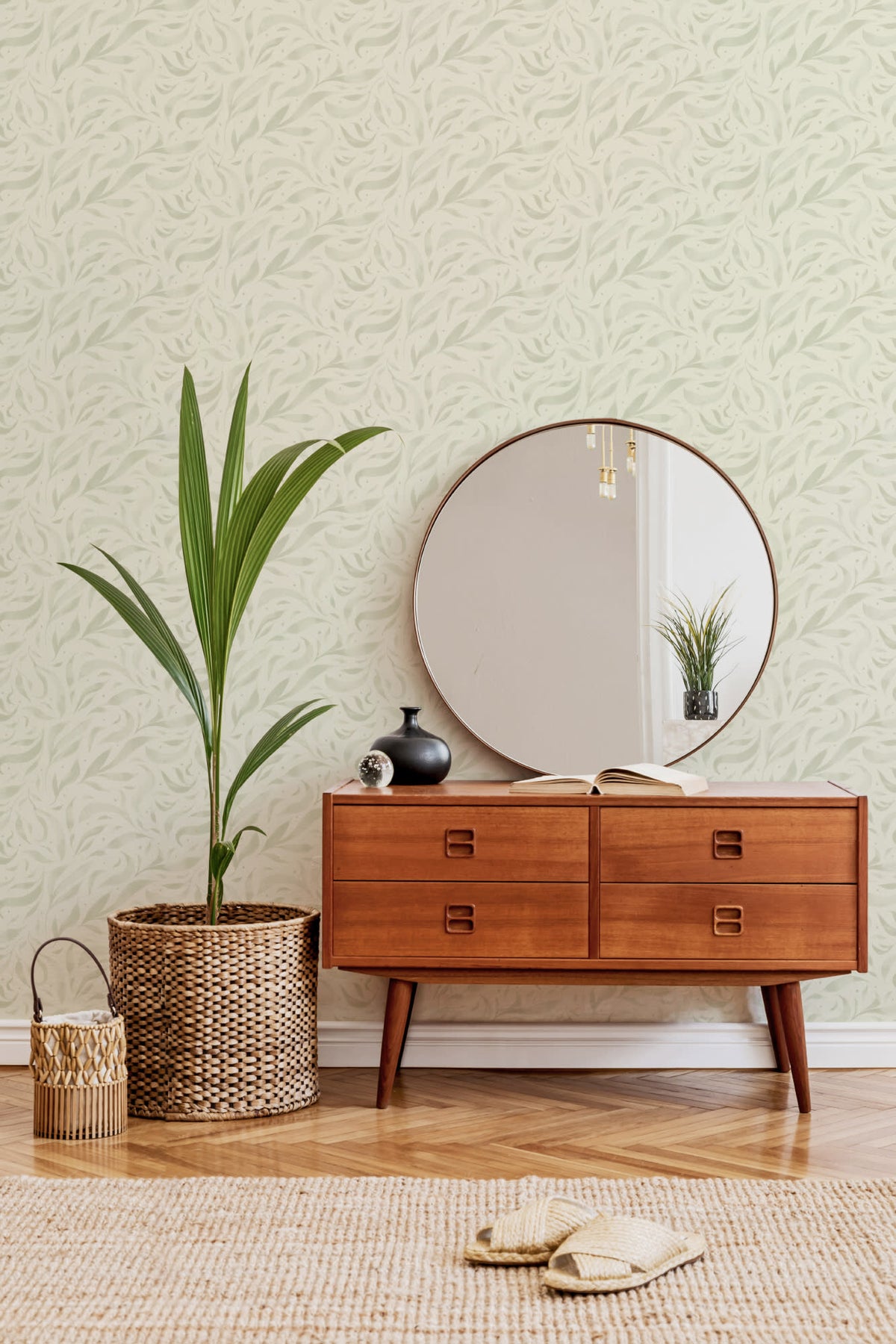 The Willow Breeze wallpaper in soft celery behind a styled console